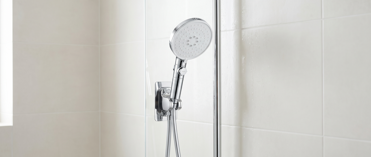 The Sorelle Five-Mode Shower Head in a wall bracket in a tiled shower